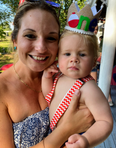 author, Katie with her son at his first birthday party, celebrating that they survived year one.