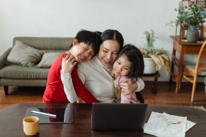 mom working with son and daughter