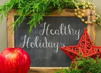 Healthy Holidays sign - words on chalkboard with decoration