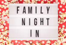 Sign reading "Family Night In" for family movie night