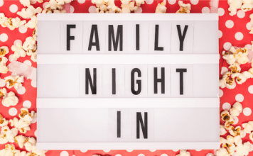 Sign reading "Family Night In" for family movie night