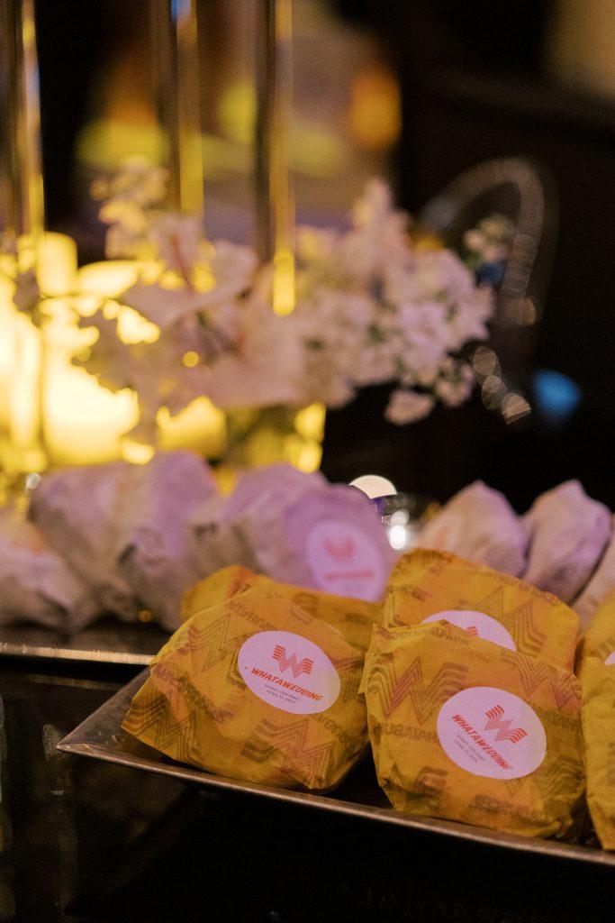 A tray of wrapped burgers from Whataburger displayed at the wedding reception.