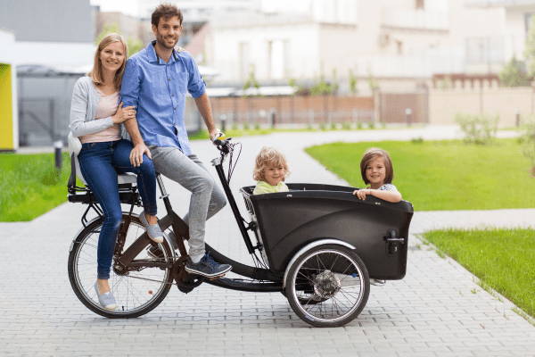 Mom and dad with two kids on an ebike
