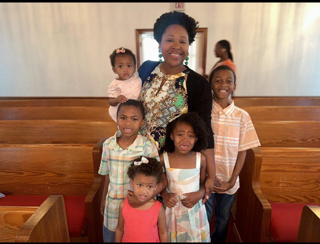 Author Lakesha Davis pictured with five of her young children at church