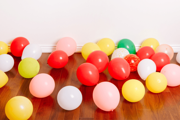Different colored balloons on the floor