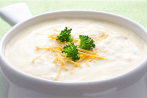 A bowl of broccoli cheese soup