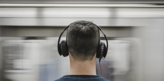 Rear view of a man with headphones on