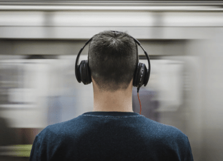 Rear view of a man with headphones on