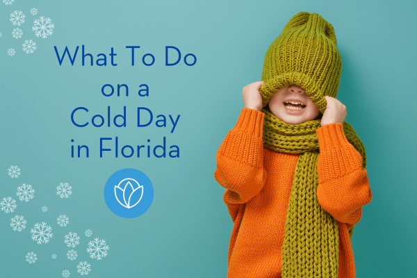 A young child wearing a sweater, hat and scarf. The hat is pulled down over his eyes and he is laughing. The title of the post "What to do on a cold day in Florida" is included.